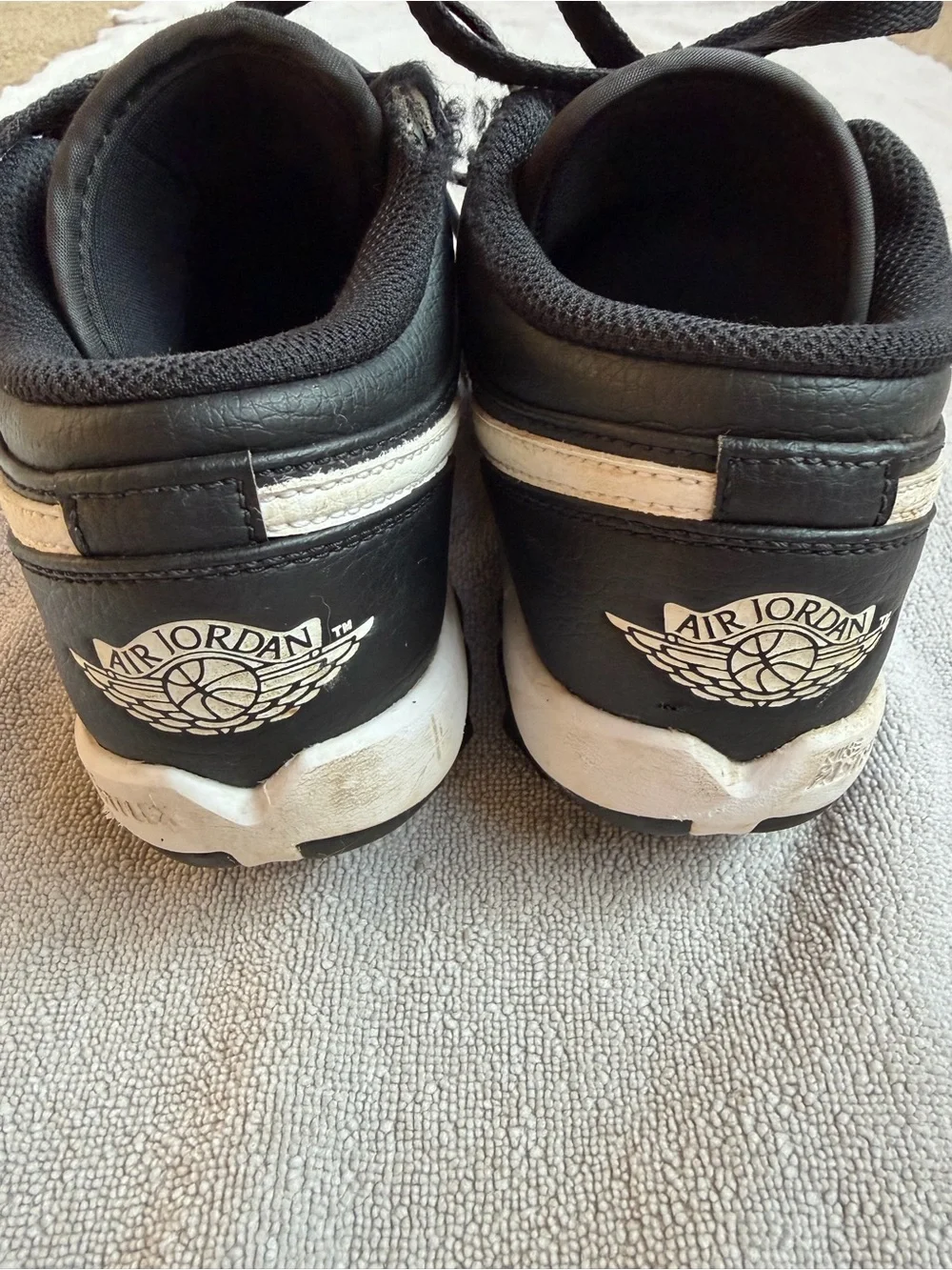 Nike Kids Black and White Baseball Cleats with Swoosh